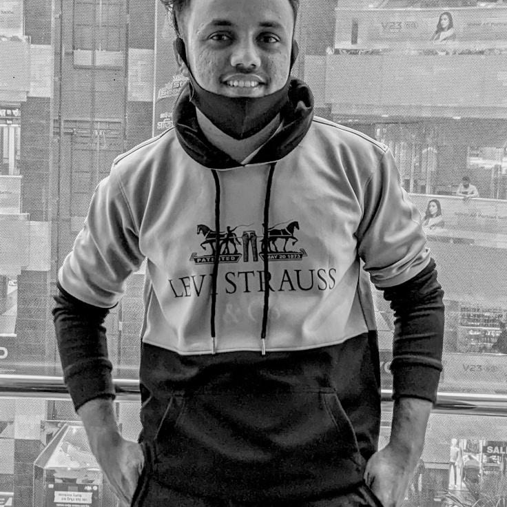 Kaveri Mehta, Lead Design Curator at BeeMintLab, reviewing corporate floral arrangements